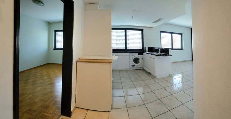 modern kitchen with white cabinets, tiled floor, washing machine, sink, windows with blinds