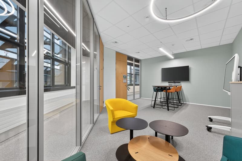 modern interior design, large glass windows, yellow armchair, round tables, television, office chair