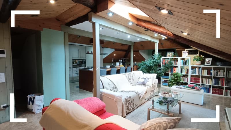 open plan layout, hardwood floors, two sofas, coffee table, armchair, glass window