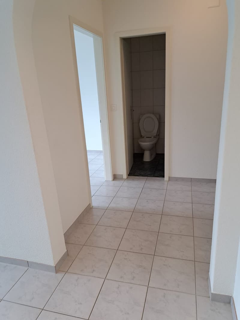 tiled floor, single door, tiled wall, toilet