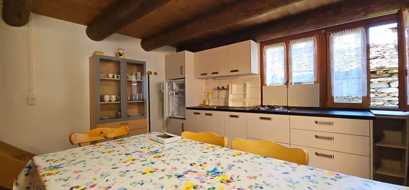 modern kitchen with wooden ceiling, cabinets, drawers, table, chairs, gas stove, windows, fridge