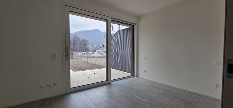 sliding glass door, balcony, tiled floor, white walls, mountain view