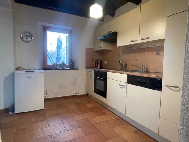 kitchen with white cabinets, brown tiled floor, sink, oven, dishwasher, refrigerator