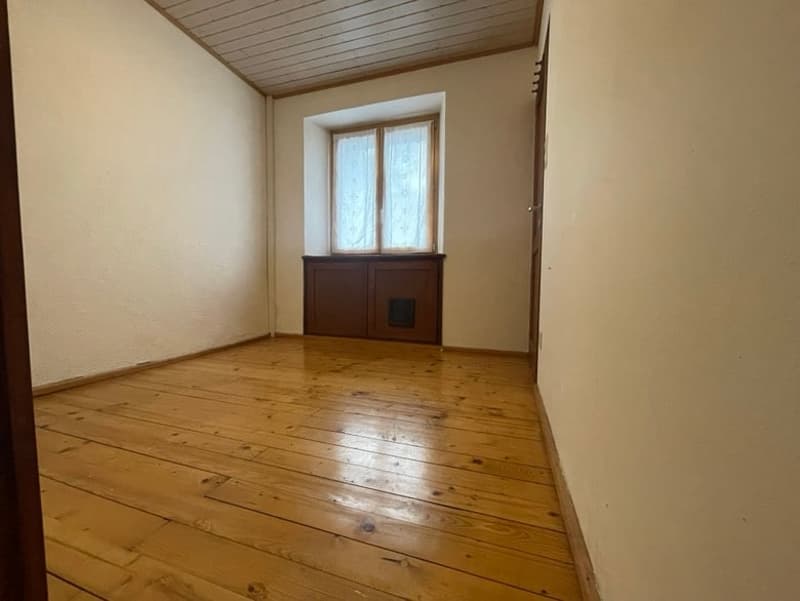 empty room, wooden floor, white walls, window, wooden cabinet
