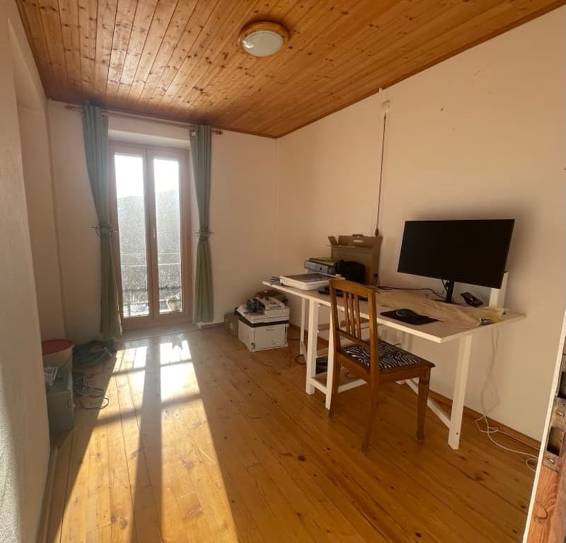 wooden floor, wooden ceiling, desk, chair, computer, printer, storage boxes, curtains, sliding glass door