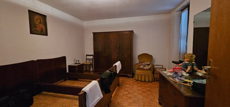 wooden bed, chair, wooden cabinet, mirror, side table, picture frame, small doll, wooden trunk, wooden floor