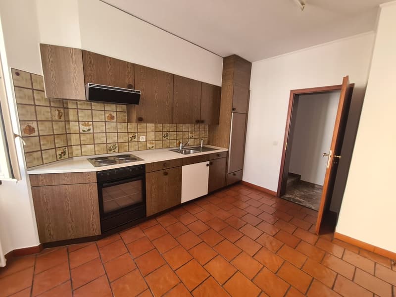 kitchen, tiled floor, wooden cabinets, stainless steel appliances, sink, faucet