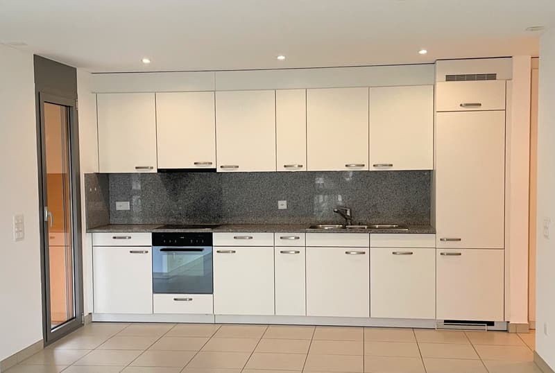 modern kitchen with white cabinets, stainless steel appliances, tile flooring, granite countertop