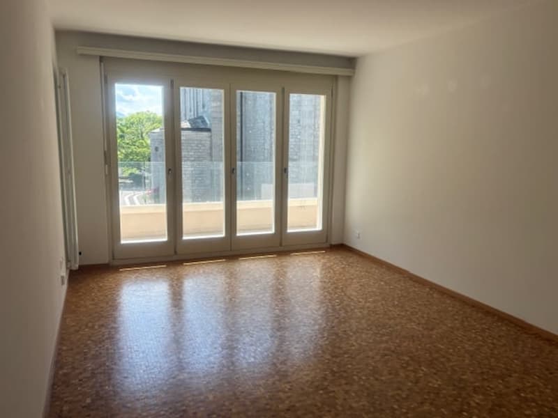 empty room, sliding glass doors, balcony, parquet floor