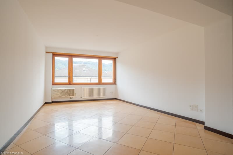 empty room, white walls, tiled floor, window with view
