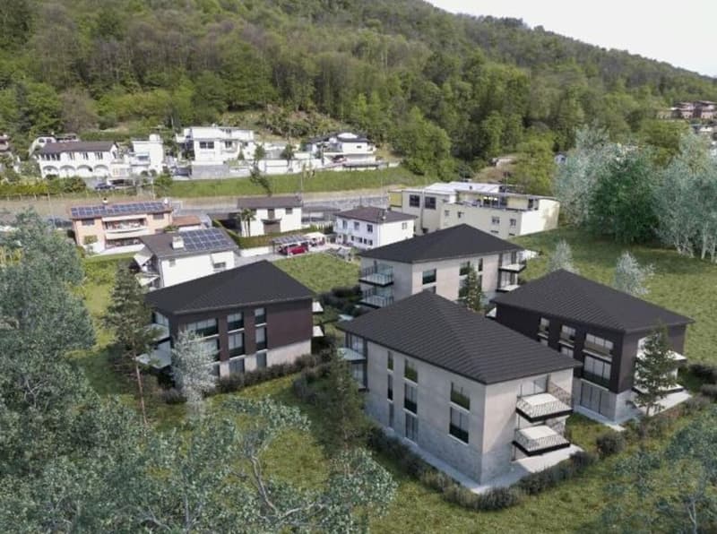 5 buildings in residential area, black rooftops, several windows, solar panels on some houses, surrounded by trees and grass