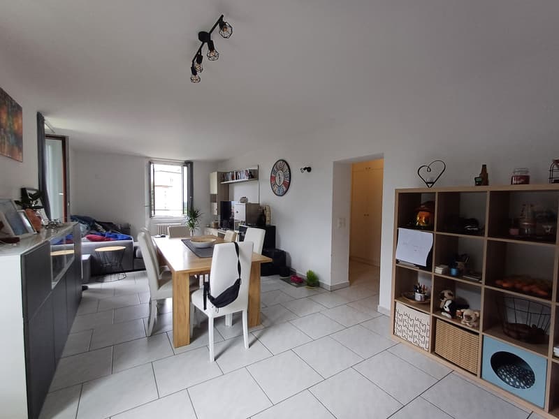 white tiled floor, white walls, modern dining set, decorative shelf, living area with couch