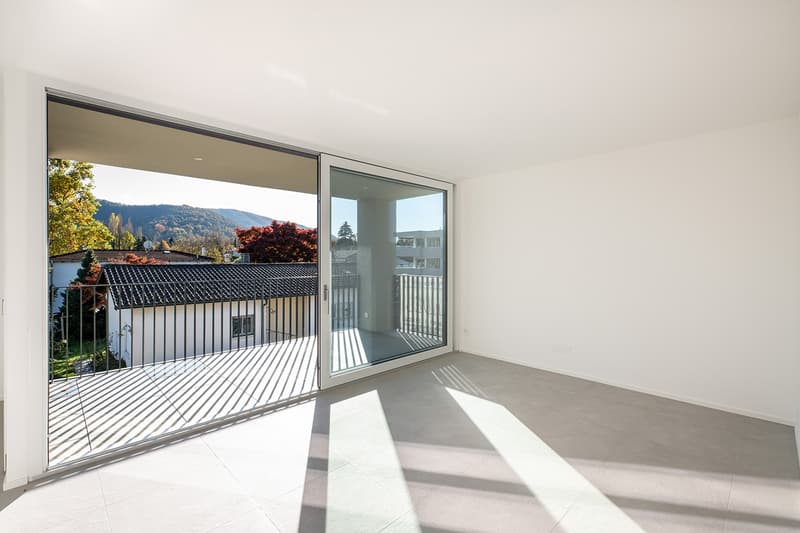empty room, sliding glass doors, balcony, tiled floor, white walls