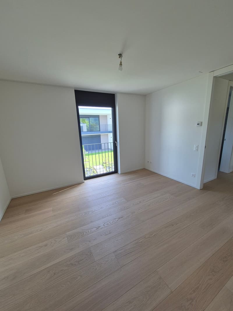 large windows, glass sliding door to balcony, parquet floor