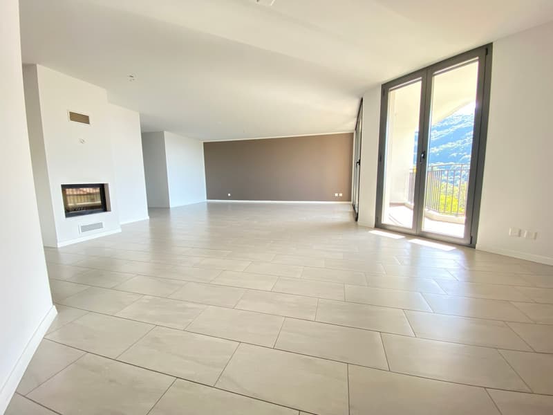 empty room, tile flooring, fireplace, large glass door, balcony