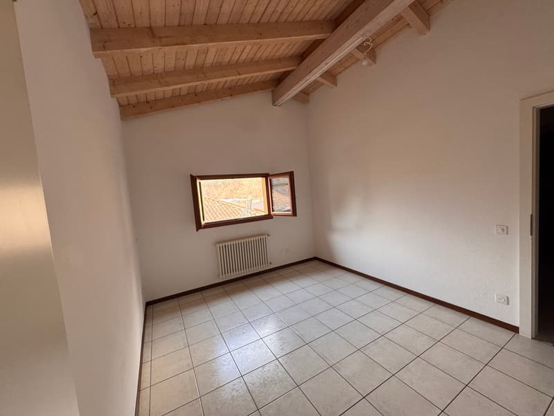 empty room with wooden ceiling, white walls, tiled floor, two windows, and a radiator