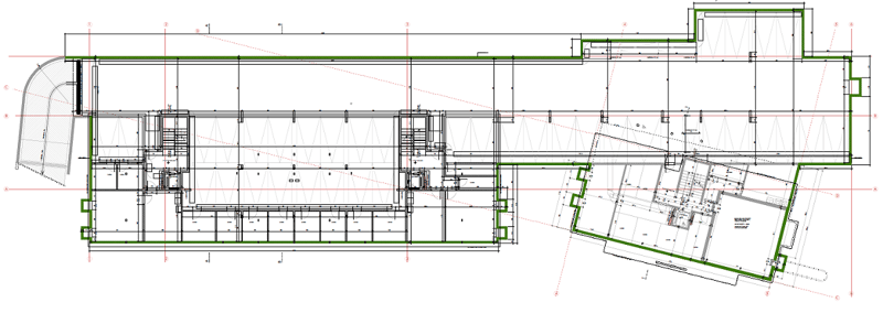 The image shows a detailed floor plan of a building. The plan includes a large main hall or auditorium space, with several smaller rooms and spaces surrounding it. The plan also includes some outdoor areas and landscaping details.