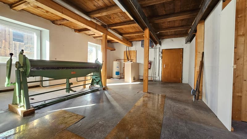 empty room, wooden beams, concrete floor, industrial machine, white walls, window