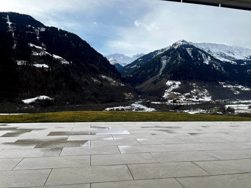 Ground floor patio with tiled floor, view of snowy mountains and valley