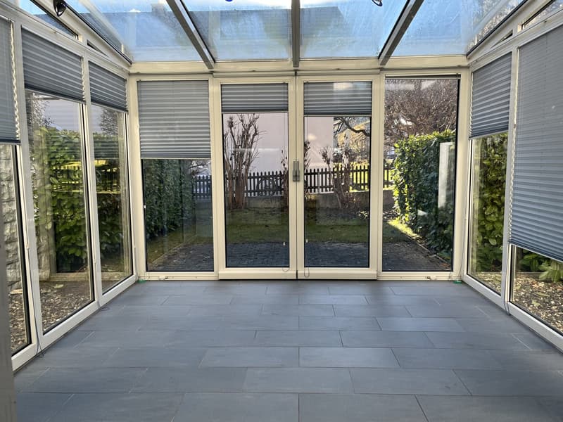 glass walls, glass doors, tiled floor, white blinds, outdoor view
