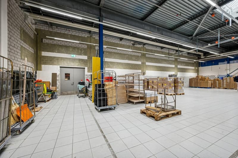industrial warehouse, tile flooring, metal shelving, storage bins, steel poles, boxes, door