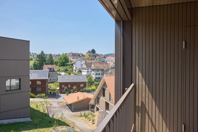 A balcony with a view of the surrounding area