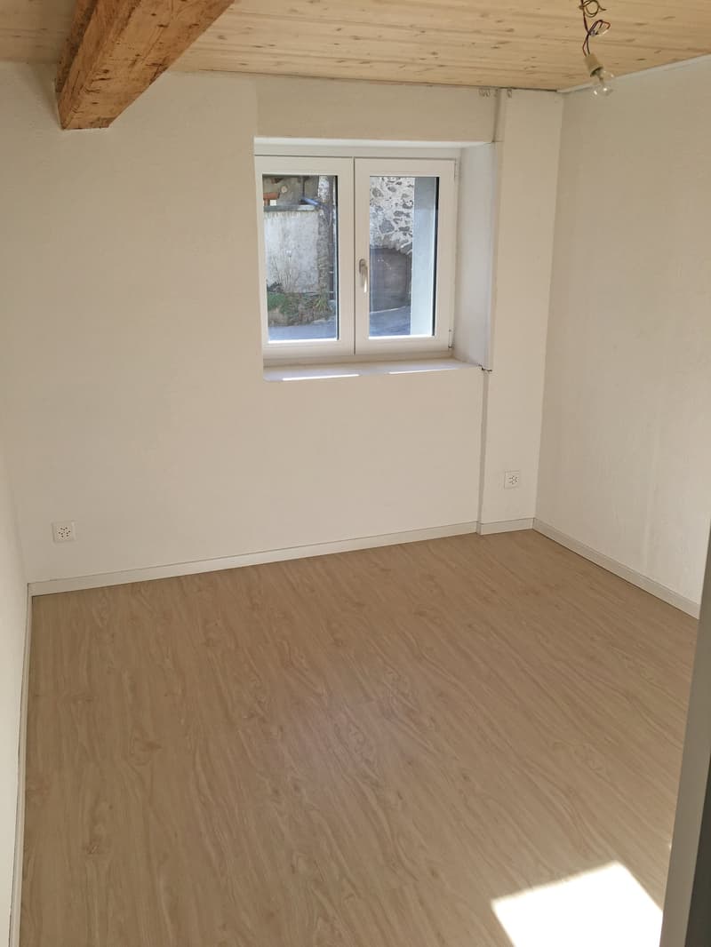 empty room, white walls, wooden floor, window, power outlets