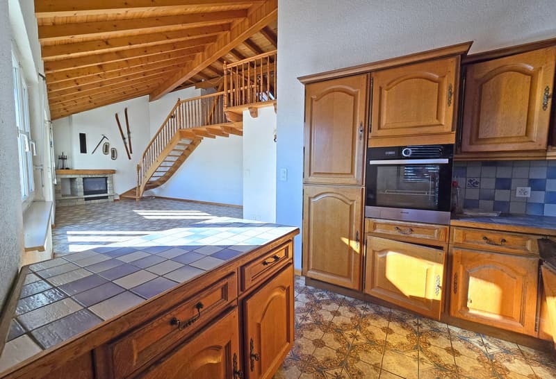 kitchen with wooden cabinets, tiled countertop, oven, fireplace in the corner