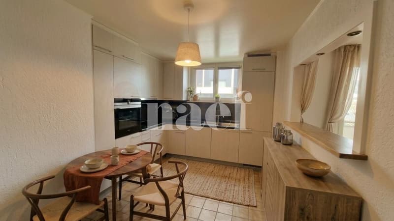 Appartement de 5.5 pièces au rez-de-chaussée avec cheminée et balcon (2)
