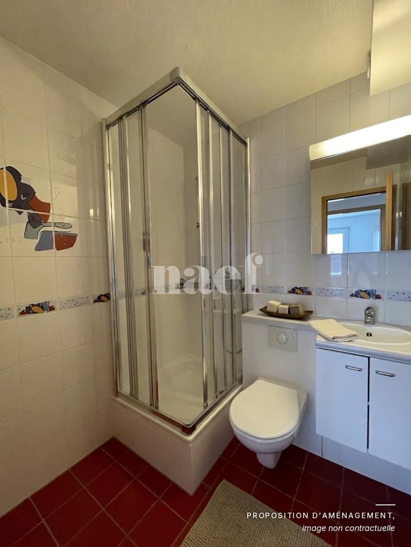 Au centre du village- Bel appartement de 5.5 pièces dans les combles avec cheminée et grand balcon (9)