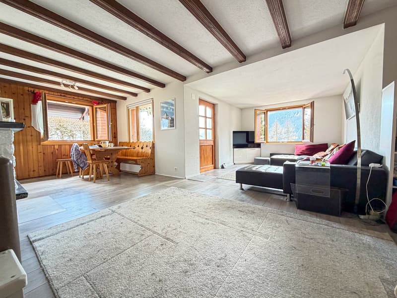 wooden ceiling, wooden floor, fireplace, large windows, dining table, couch, television
