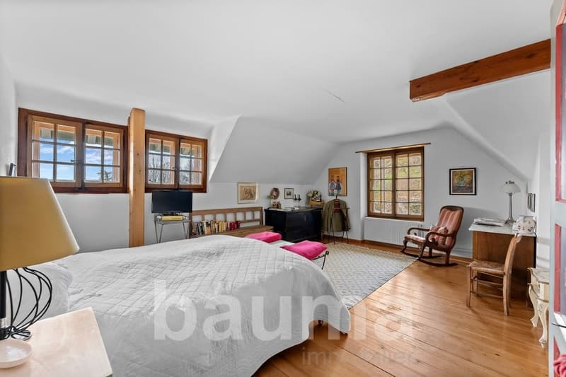 Wooden floor, wooden wall, wooden chair, rocking chair, bed, blanket, lamp, television, table, frame, radiator, window