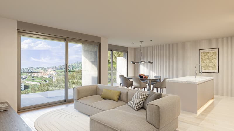 Spacious open-plan living room with large windows offering a scenic view, a comfortable gray sectional sofa, a dining table with chairs, and a modern kitchen with a marble countertop