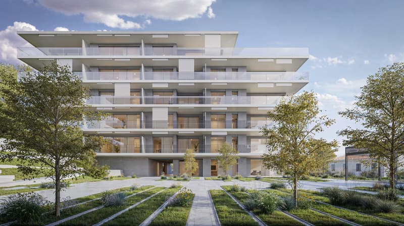 A modern, multi-story apartment building with a clean, minimalist design. The building features large windows and balconies on each floor, providing ample natural light and outdoor space for the residents. The exterior is predominantly white with some gra