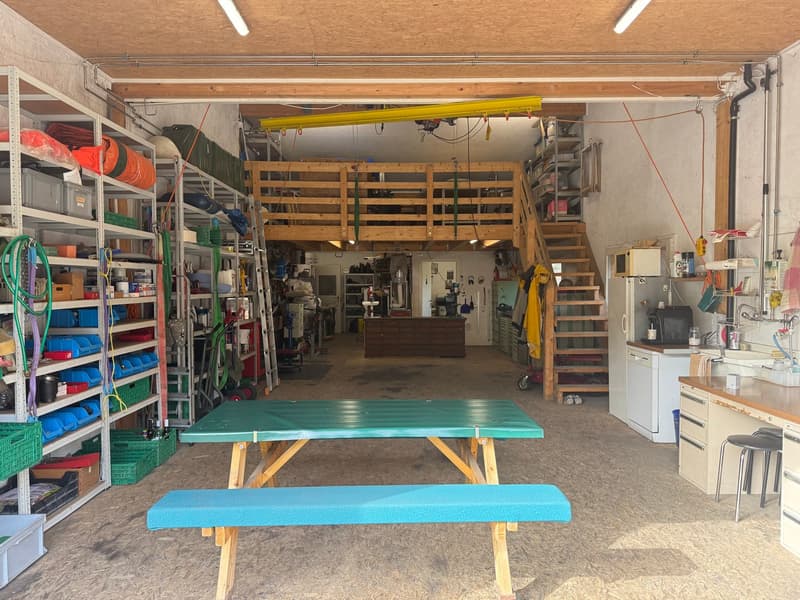 wooden shelves, ladder, tools, benches, table, desk, sink, microwave, dishwasher