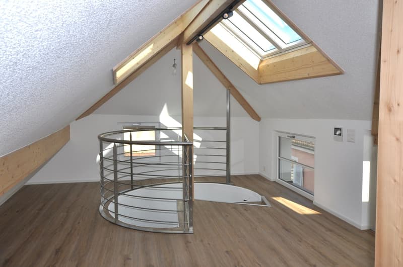 attic with spiral staircase, wooden ceiling, skylight, white floor, three windows