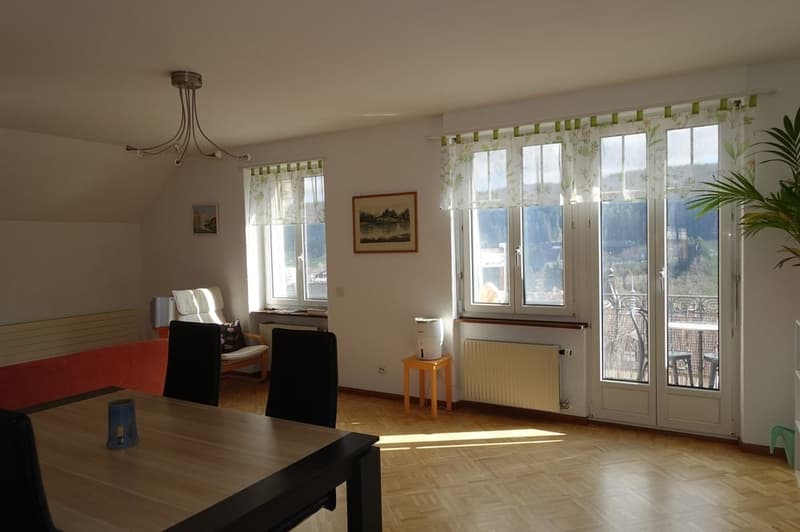 Chandelier, hardwood floor, table, chairs, sofa, picture frame, balcony with view, radiator, window curtain