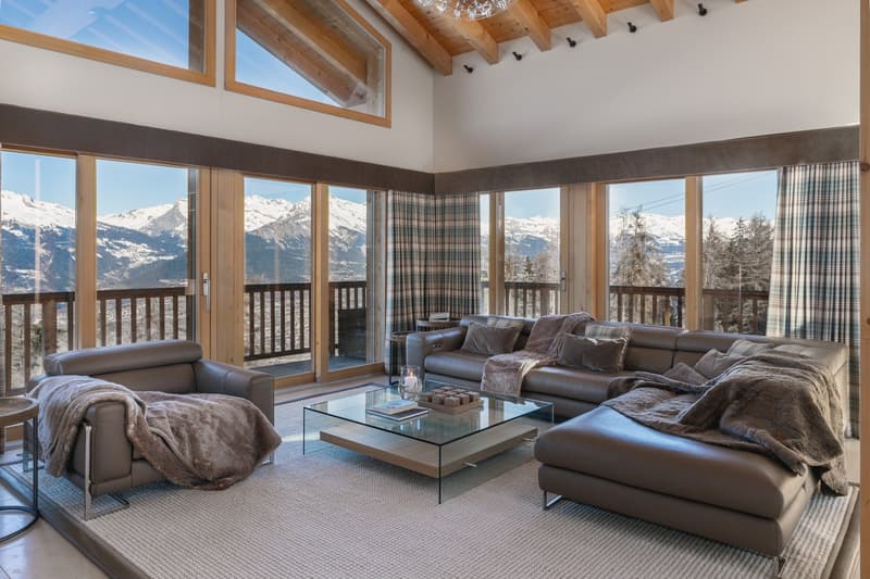 ample living space, U-shaped sofa set, glass coffee table, glass sliding doors to balcony, carpet flooring, huge glass windows