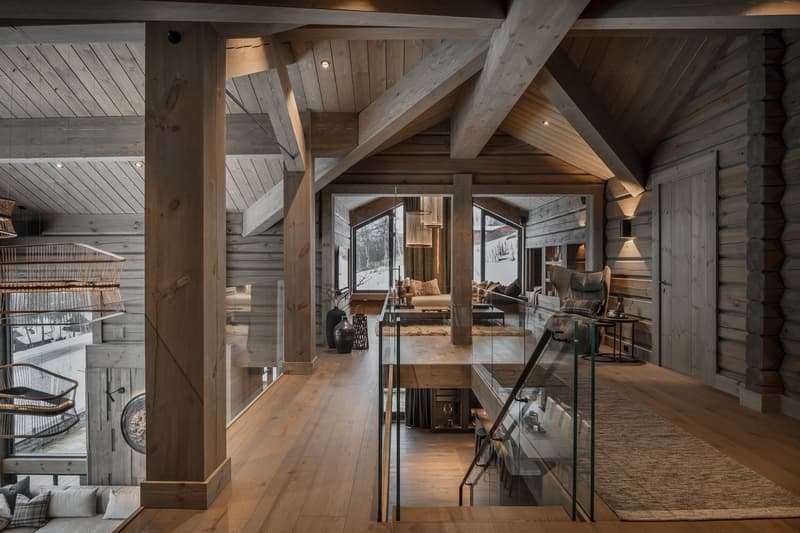 modern design, wooden pillars, hardwood flooring, glass walls, couch, large windows