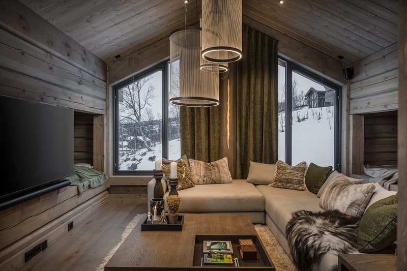 wooden walls, large sofa, large windows, coffee table, TV