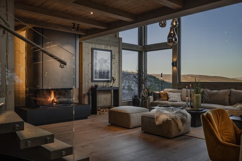 wooden floor, large windows, fireplace, wooden wall, sofa, coffee table, modern design, mountain view