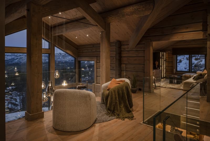 glass windows, chandeliers, modern furniture, fireplace, couch, chair