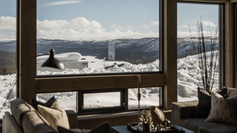 large windows with view of snowy mountains