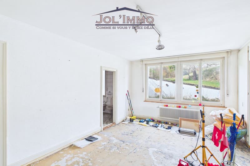 Propriété de caractère avec 3 appartements et terrain à bâtir à Perrefitte (10)