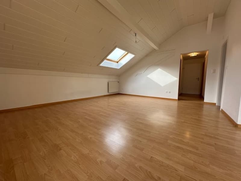 empty room, wooden floor, white walls, wooden ceiling, skylight