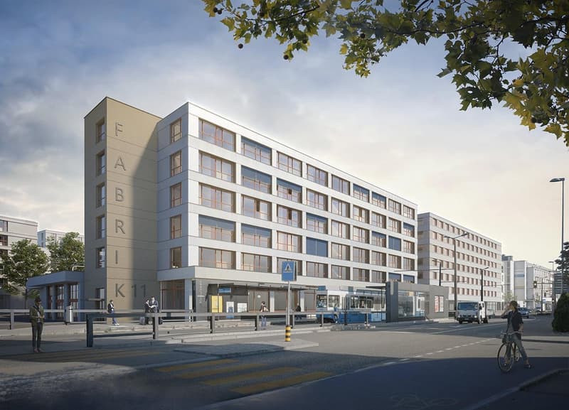 Large multi-story building, glass windows, modern architecture, outdoor seating area, trees and plants, nearby street and bus station