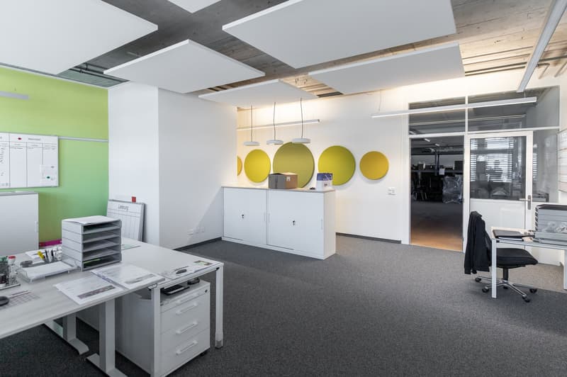 modern office with desks, whiteboards, office equipment, glass door, ceiling-mounted lighting