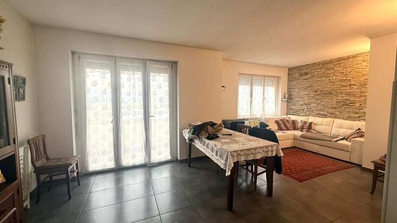 dining room with large windows, modern sofa, dining table, chairs, carpet