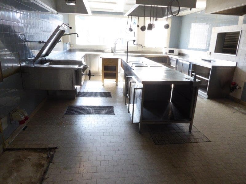Stainless steel countertops, faucets, gas range, tile flooring, kitchen hoods, windows