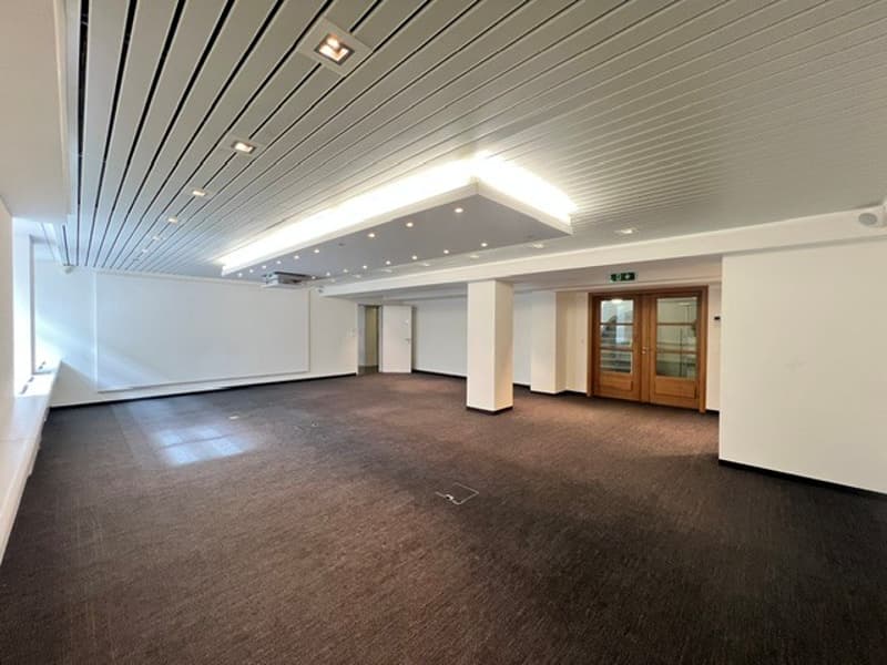 empty room, white walls, wooden floor, white ceiling, wooden door, windows